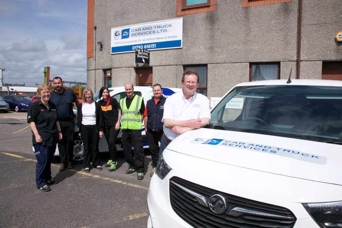 Car &amp; Truck Swindon team standing next to van